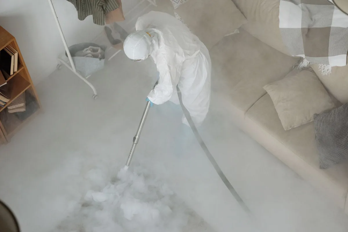 Biohazard cleanup technician in protective equipment, New Hope, OR